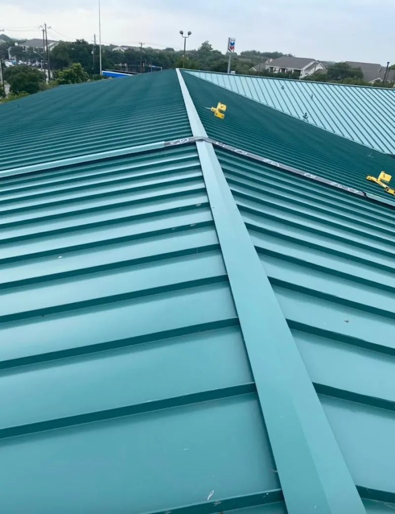 Green commercial metal roof ridge and valley for Metal Roof Repair in Orleans