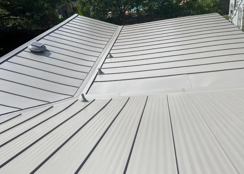 Solar attic fan installed on a metal roof for Roof Ventilation in Orleans